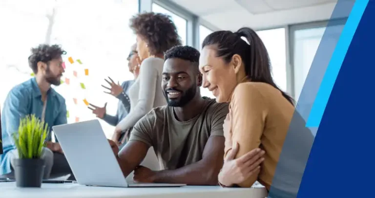 man and woman at computer in office