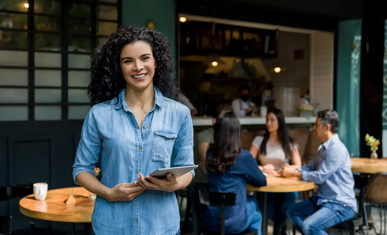 business woman with ipad in cafe