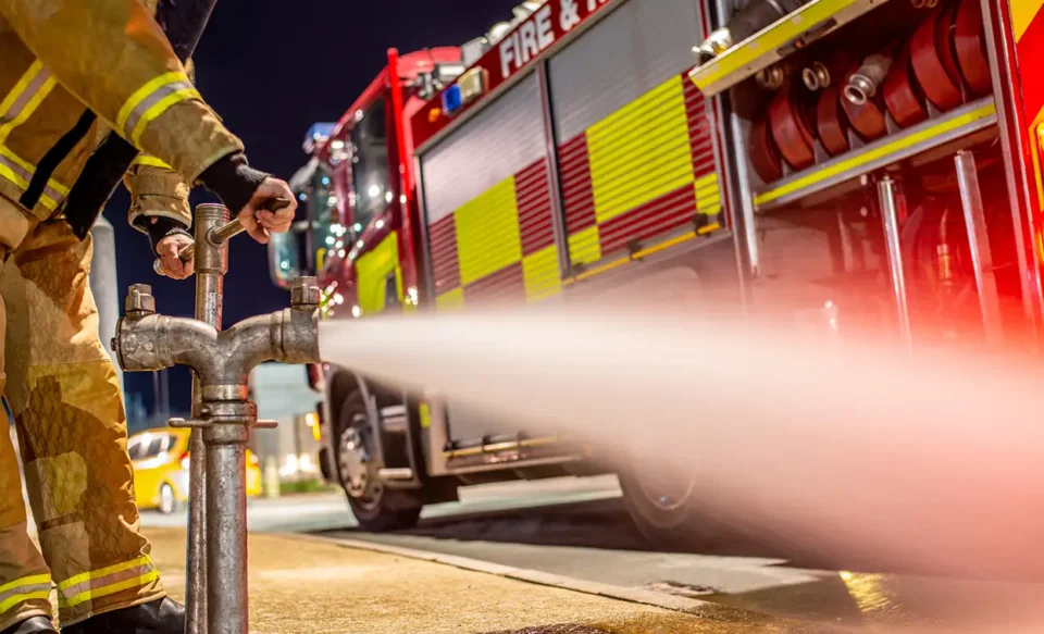 Fireman opening fire hydrant