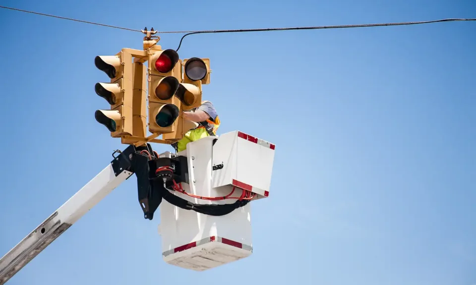 Man working on traffic lights
