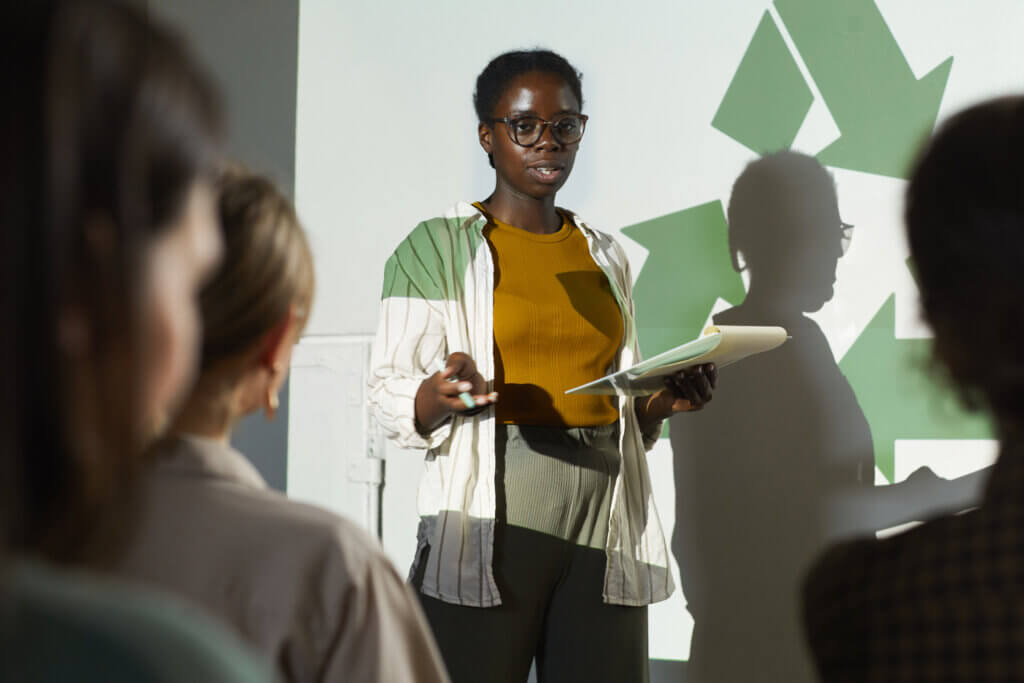 African-American Woman Presenting at Eco Conference