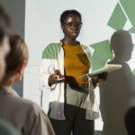 African-American Woman Presenting at Eco Conference