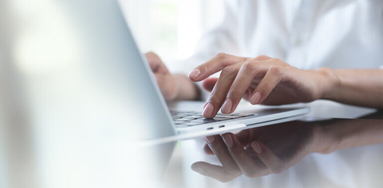 person typing on computer