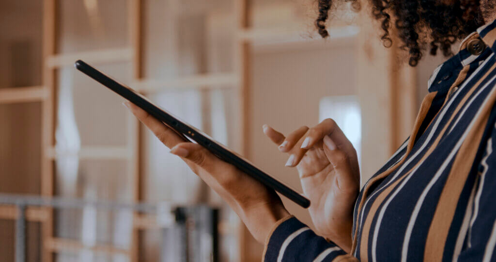 Woman's hands on tablet | Accela Customer News