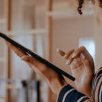 Woman's hands on tablet | Accela Customer News