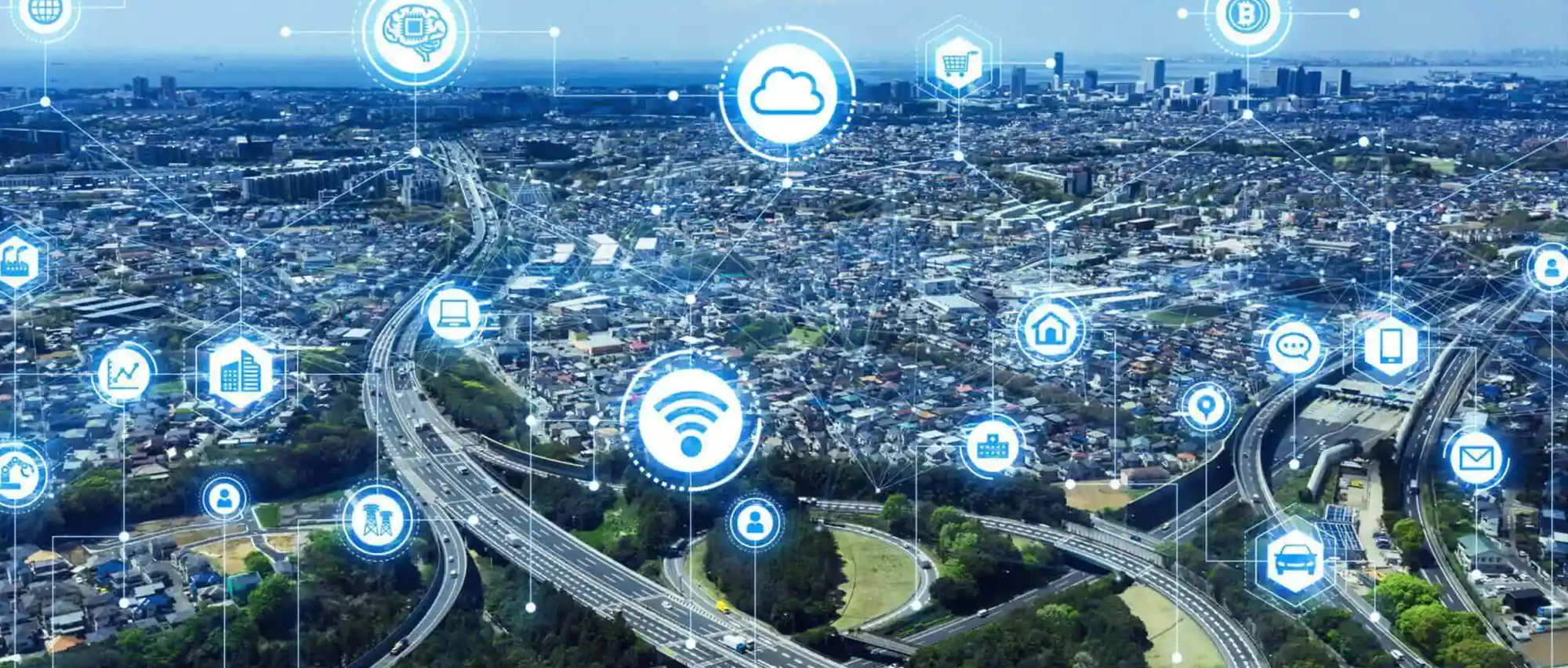 A metropolitan cityscape with many technical icons superimposed – for example, wifi, email, SMS.