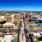 Aerial of Downtown Mesa, Arizona, with a light rail line in the center. Mesa is part of the Phoenix Metropolitan Area.
